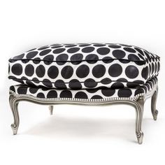 a black and white polka dot covered ottoman