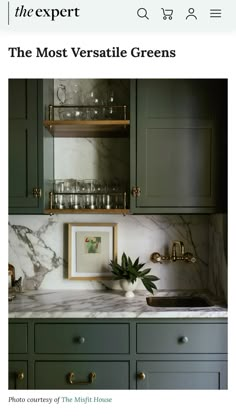 a kitchen with green cabinets and marble counter tops