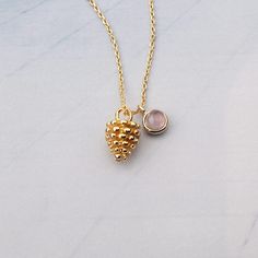 This necklace is made of hypoallergenic brass that is nickel-free and safe for skin that is sensitive, and it is 14k gold-plated. Pine cone-shaped pendant with gemstone accents. A great way to layer necklaces. Material : 14k Gold plated over Brass, Gemstone Pendant : 7.5 mm x 11.5 mm Gemstone : 4 mm Pine Cone Jewelry, Plant Necklace, Layer Necklaces, Gold Pendants, Personalized Birthday Gifts, Necklace Personalized, Pine Cone, Birthstone Necklace, Personalized Birthday