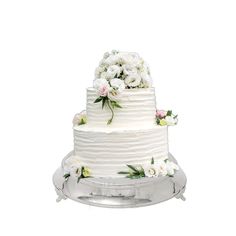 a three tiered cake with flowers on the top and bottom layer is displayed in front of a white background