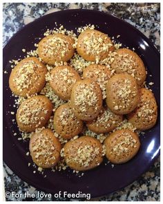 a plate filled with muffins and sprinkled with sesame seeds on top