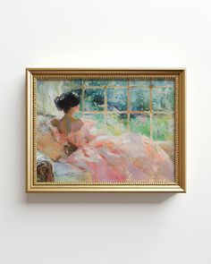 a painting hanging on the wall with a woman in a pink dress sitting by a window