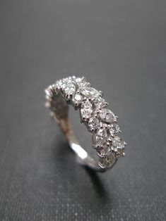 an image of a ring with diamonds on it