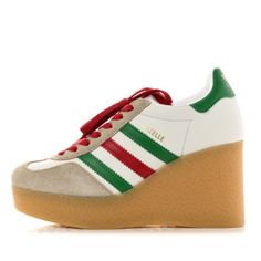 This Is Hands Down, One Of My Favorite Limited Edition Collaborations! Gucci And Adiddas Have Teamed Up Tp Create Hands Down, One Of The Best Sneaker Styles To Date. You Get To Have Ypur Iconic And Stylish Gucci Shoe With The Comfort Of An Adiddas Sneaker, And The Added Feminine Twist Of A Wedge. These Shoes Are Definitely A Must-Have With The Red And Green Stripes Pairing With Any Gucci Items You May Have. Pair With Your Jeans, Skirts, White Tees, Gucci Tees, And Your Favorite Gucci Handbag, An Gucci Tee, Gucci X Adidas, Adidas Suede, Gucci Shoe, Hibiscus Red, Skirts White, Adidas Three Stripes, Gucci Handbag, Wedge Sneakers