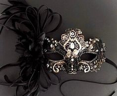 Masquerade mask in black gold. Simplistic for woman with a black floral- destined to pop out at any event, wedding etc This masquerade mask is great for any occasion. Black Masquerade Mask Aesthetic, Elegant Wedding Masks, Black Formal Eye Mask Masquerade, Elegant Black Formal Mask, Elegant Formal Mask For Carnival, Elegant Formal Masks For Carnival, Elegant Black Masquerade Mask For Halloween, Black Masquerade Mask For Halloween Wedding, Elegant Formal Masquerade Mask For Halloween