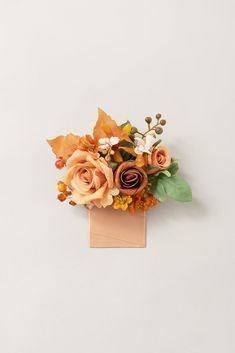 an arrangement of flowers on a white background