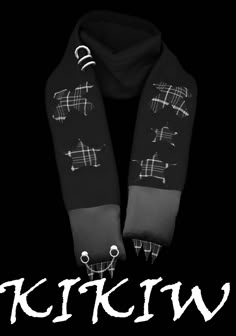 the scarf is black and has white writing on it that says, krykw