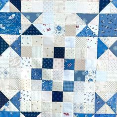 a blue and white patchwork quilt is shown