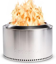 a stainless steel stove with flames coming out of it's top and bottom lid