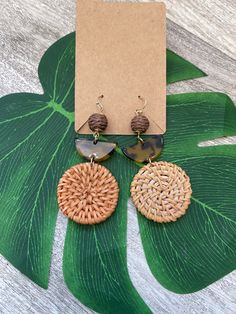 The perfect everyday earring to dress up you look. Rattan circle with acrylic accents Everyday Circular Summer Jewelry, Trendy Summer Earrings, Trendy Brown Circular Earrings, Trendy Brown Circle Earrings, Trendy Dangle Earrings For Vacation, Trendy Circle Earrings For Everyday, Trendy Circle Earrings, Trendy Adjustable Beige Earrings, Trendy Single Circle Earring