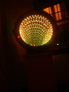 a traffic light that is lit up in the dark