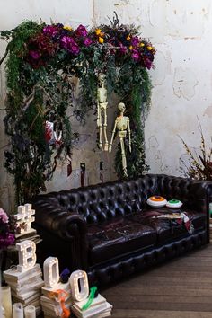 a living room filled with furniture and flowers