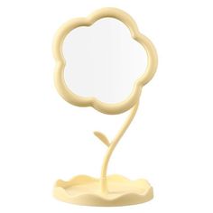 a mirror that is shaped like a flower