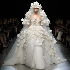 a white wedding dress with flowers on it