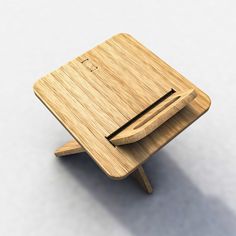 a small wooden table with a pen on it's top and one drawer open