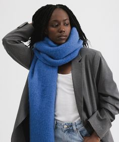 The Mik blanket scarf is the ultimate go to this winter. This super soft, oversized design can be styled various ways to fit your vibe. Let Mik hang long + low over your shoulders, wrapped tight around your neck or draped around your face for ultimate warmth from a chilly breeze! Trendy Scarves For Cold Weather, Cozy Soft Knit Scarf, Knit Scarves For Cold Weather, Soft Knit Scarves For Cold Weather In Fall, Oversized Casual Fall Scarves, Casual Oversized Scarf For Fall, Blue Winter Scarves For Cold Weather, Blue Scarves For Fall, Cozy Blue Scarves For Fall