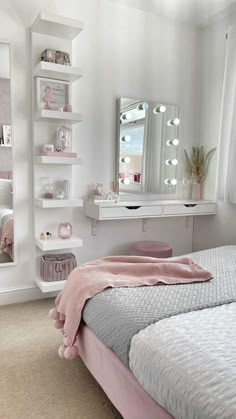 a bedroom with a bed, mirror and shelves on the wall next to each other