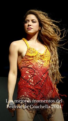 a woman with long hair in a red and yellow dress