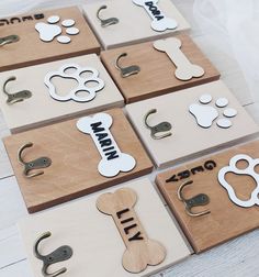 several wooden magnets with different types of dog related items on them, all in various shapes and sizes