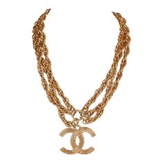 This vintage Chanel necklace is in 24K gold plated metal and has a large etched classic CC pendant with three rope chains and spring ring closure. Origin: FranceCollection: 1980sCondition: Vintage; Excellent. Minor signs of wear, including light brushing and tarnishing. Accompanied by: Chanel boxMeasurements: Chain Drop: 6.5", Chain Length: 15", Pendant: 1.5" x 1" 1980s Necklace, Chloe 2024, Cc Necklace, Chanel Jewellery, Coco Chanel Fashion, Chanel Box, Chanel Necklace, Fringe Necklace, Chanel 2