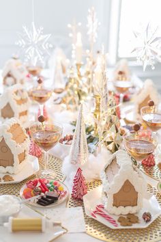 a table topped with lots of different types of desserts and cookies on top of plates