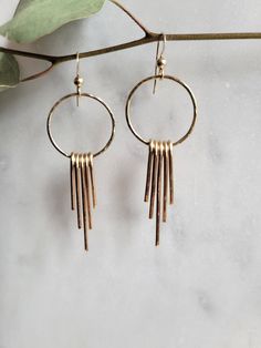 Super fun Hoop Fringe Earrings. You have a choice between Sterling Silver or 14 K Gold Filled. Each piece of the fringe is hand formed and hammered for texture and shine. The hoop is hammered as well. The earrings hang down approx. 2 in. My commitment to you: I hand make each of my products and hand pick all of the materials that I use in my pieces. Each piece may vary slightly due to the fact that it is handmade but that is what makes your piece so special! I don't take it lightly that you are Silver Circle Earrings, The Fringe, Wire Earrings, Jewelry Business, Fringe Earrings, Circle Earrings, Creative Fashion, Wire Wrap, Boho Earrings