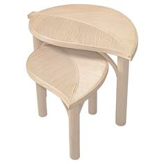 two wooden stools stacked on top of each other in the shape of leaf shapes