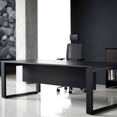 an office desk with two black chairs and a book shelf in front of the desk