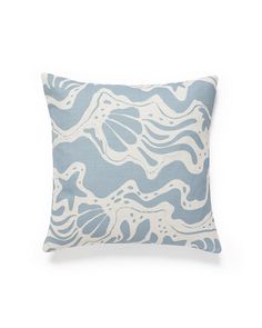 a blue and white pillow with waves on it