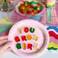 a paper plate that has gummy bears on it