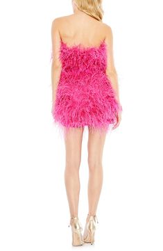 Fully and festively commit to the feather trend in a joyful mini that will get glasses raised. 35" length Hidden back-zip closure Strapless Attached sash Lined 100% polyester with ostrich-feather trim Spot clean Imported Asian Owned/Founded Pink Feather Dress, Embellished Fabric, Plastic Dress, Satin Sash, Dress Guide, Unique Prom Dresses, Column Dress, Feather Dress, Sash Belt