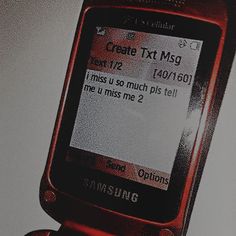 an old cell phone with texting on the screen