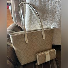 Coach Tote Bag/ Wallet Set. Beige/ White Coated Canvas, 2 Very Small Marks On Bag ( Hardly Noticeable) Otherwise Very Clean In Near New Condition. No Wear On Seams. Matching Wallet Barely Used, A Couple Small Marks Inside, No Wear Inside Or Out. Bag Is 10.5hx15w. With 10 Inch Strap Drop. Wallet Is 7.5 Inches. Coach Tote Bag, Beige Tote, Coach Tote Bags, Coach Tote, White Coat, Coach Handbags, Womens Tote Bags, 10 Inch, Coach Bags