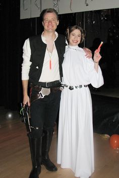 a man and woman dressed up in costumes