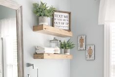 two wooden shelves above a sink in a bathroom