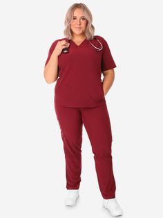 Our Women's Stash-Pocket Scrub Top is our most flattering scrub top for all body types -- big or small, short or tall; you will look great in this scrub top. Its shape gives it a slim appearance without feeling overly fitted. Our signature mesh accents at the sides provide additional stretch and breathability. Our favorite thing about this sporty scrub top is the secret “hoodie-style” pocket -- the perfect place to stash your hands, instruments, and stuff. We recommend wearing this top untucked. First Year Student, 130 Lbs, Hoodie Style, Scrub Sets, Triple Threat, Royal Blue Color, Long I, Scrub Tops, Burgundy Color