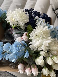 a bunch of flowers sitting on top of a table