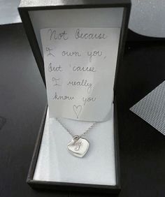 a note attached to a necklace in a box with a heart on it that says not because if own you, but cause i usually know how you know