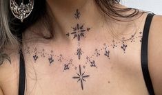 a woman with a cross tattoo on her chest