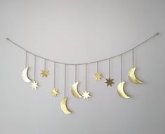 the moon and stars are hanging on the wall