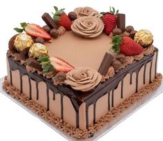 a chocolate cake with strawberries and chocolates on top