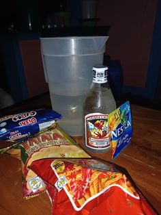 some chips and water on a wooden table