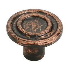 an old, rusted metal knob on a white background