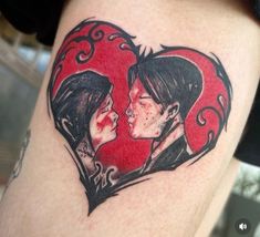 a couple in a heart tattoo on the thigh