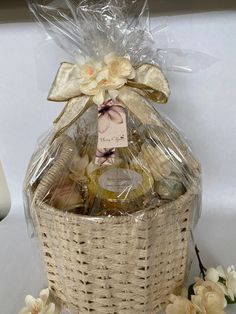 a wicker basket filled with bath products and flowers