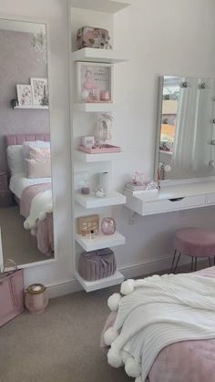 a bedroom with a bed, desk and mirror