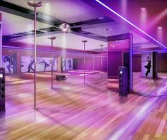 an empty dance studio with purple lighting