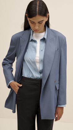 Made of a lightweight silk charmeuse, this slim fit blouse is bound to be your new go-to. The long-length button-up features lined lapels, a silk charmeuse combo lining the cuffs, and side slit hems. Wear this top partially tucked, fully tucked, or untucked with your favorite pair of trousers. Corporate Work Outfits, Corporate Office Outfits, Pigeon Blue, Outfit Casual Chic, Luxury Outfit, Slim Blouse, Corporate Offices, Versatile Jacket, Belted Blazer