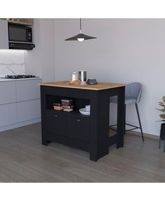 a small kitchen island in the middle of a room