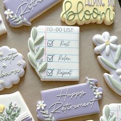 decorated cookies are displayed on a table for someone to write their wedding vows and congratulations messages